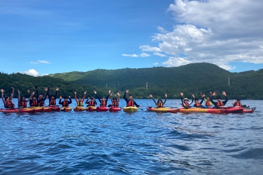 Image of MYP students on a lake kayaking during their an annual trip to Hakuba, Nagano
