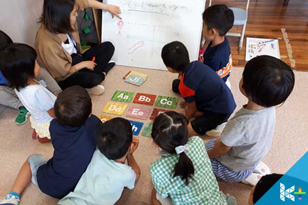 Image of local Japanese students learning the basics of English in a international environment